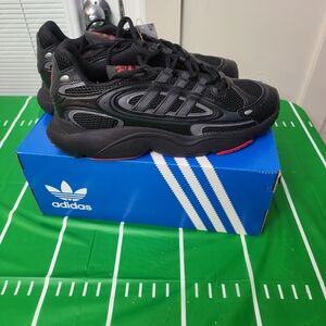 Brand New Adidas Black and Red Sneakers Never Worn.